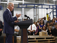 Vice President Joe Biden, right, speaks to staff during a visit at the Bobrick Washroom Equipment Factory in Los Angeles on Wednesday, July 22, 2015. (AP Photo/Nick Ut)