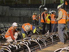 Construction workers building a commercial building foundation - some of the many jobs created through NMTC funding